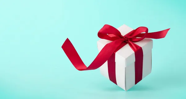 White Gift Box Red Ribbon Blue Background Space Your Christmas — Stock Photo, Image