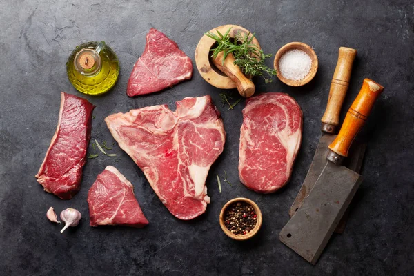 Various Raw Beef Steaks Herbs Spices Top View Flat Lay — Stockfoto