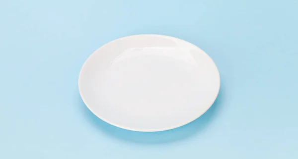 Empty White Plate Blue Background Space Your Meal — Stock Photo, Image