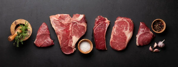 Various Raw Beef Steaks Herbs Spices Top View Flat Lay — Foto Stock