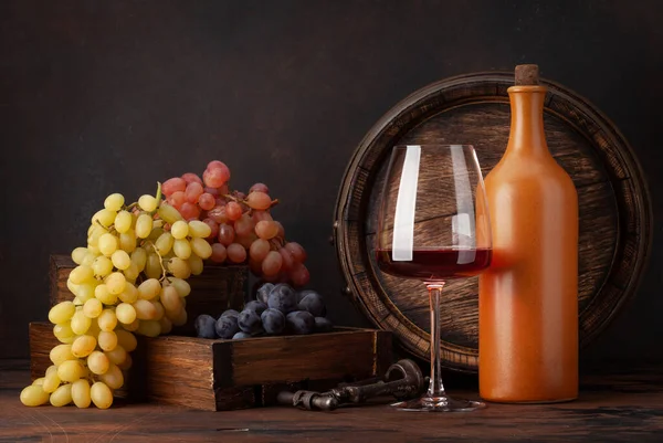 Wine Bottle Grapes Glass Red Wine Old Wooden Barrel Copy Stock Image