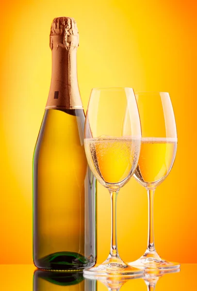 Two Champagne Glasses Sparkling Wine Bottle Yellow Background — Stock Photo, Image