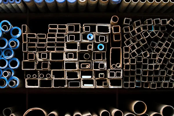 Stacked steel pipes and tubes background — Stock Photo, Image