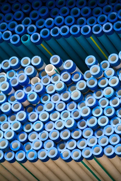 Stacked steel pipes and tubes background — Stock Photo, Image