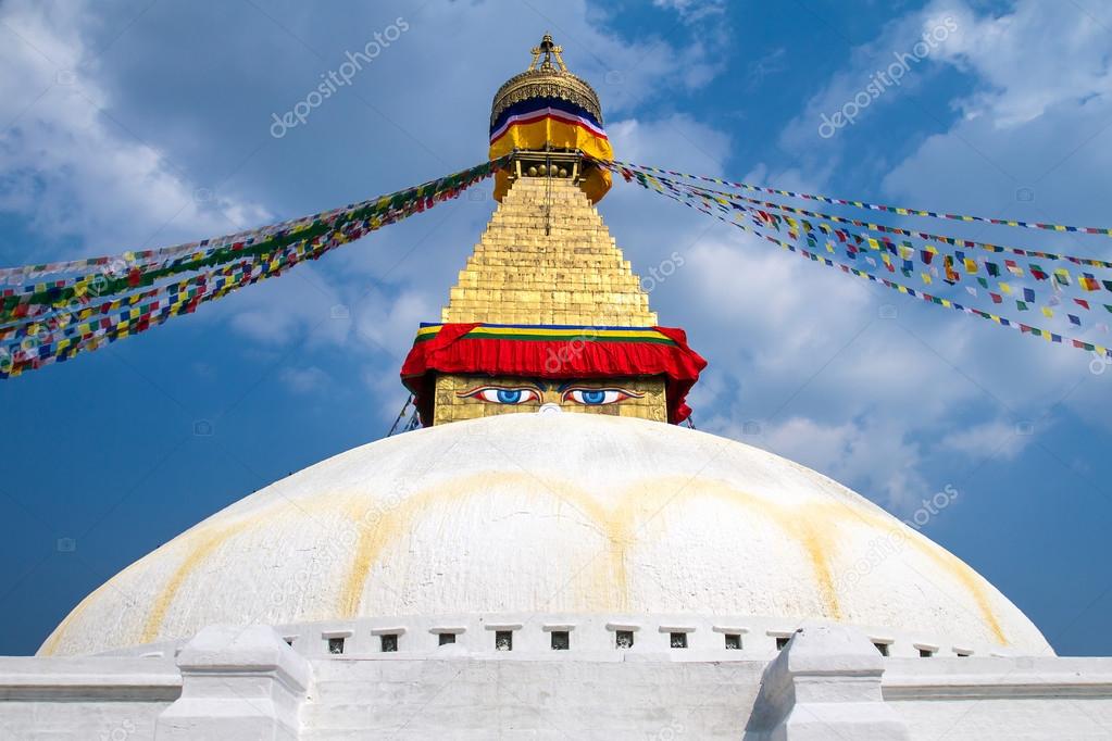 Buddhist shrine Boudhanath Stupa with Buddha wisdom eyes and pra