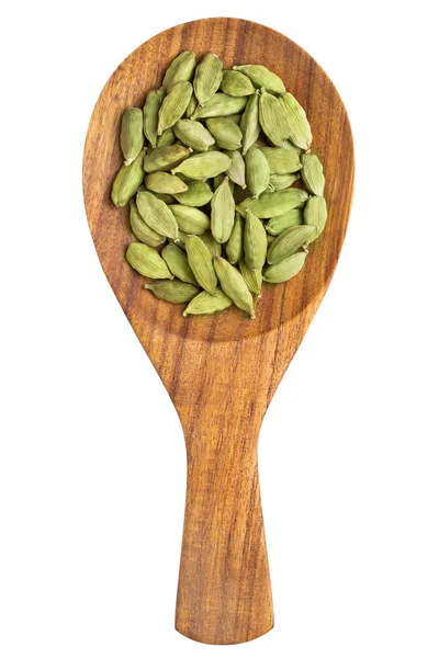 Cardamom seeds in the wooden spoon — Stock Photo, Image