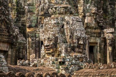 Stone faces  at Bayon Temple clipart