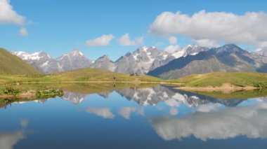 Caucasus mountains reflecting in calm water of Koruldi lakes in Svaneti, Georgia