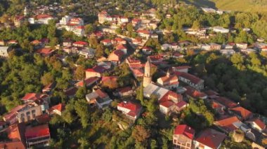 Aerial drone footage of the Signagi city, city of love, Kakheti Region, Georgia. Sighnaghi is a popular tourist destination in Georgia. Drone view of the cityscape of Signahi at sunrise.