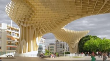 Seville, Spain - April 20, 2022: Metropol Parasol in Plaza de la Encarnacion in Sevilla, Spain. J. Mayer H. architects, it is made from bonded timber with a polyurethane coating. 