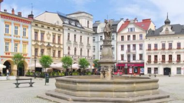 Cieszyn, Poland - June 16, 2022: Cieszyn market square with fountain and historical buildings at sunny day, Silesian voivodeship, Poland. Steadicam footage