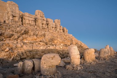 Antique statues on Nemrut mountain at dawn in Turkey. Ancient stone heads at the top of 2150 meters high Mount Nemrut.
