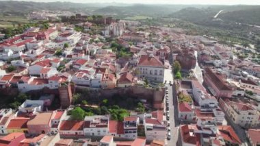 Aerial view of Silves medieval town in Algarve region of Portugal. Flying over Silves old town with historic Cathedral church and historic fortress.