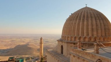 Zinciriye Medresesi or Sultan Isa Madrasa in Mardin, Eastern Anatolia, Turkey. Establishing shot of the beautiful Mardin old town cityscape seen from Zinciriye Madrasah roof