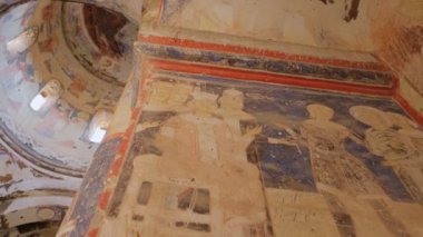 Ani, Turkey - October 14, 2021: Historic christian Frescos of ruined Armenian church in Ani town, ruined medieval Armenian capital, situated now in the Turkeys province of Kars. Slow panning footage