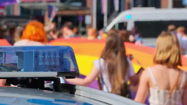 Blue Light Flasher Atop Police Car Lgbt Pride Parade Defocus — Stock Video