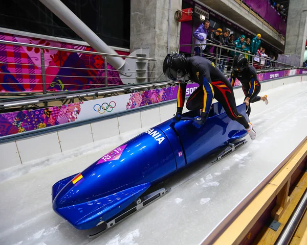 To-mands bobsleigh varme - Stock-foto