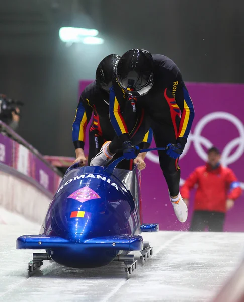 To-mands bobsleigh varme - Stock-foto