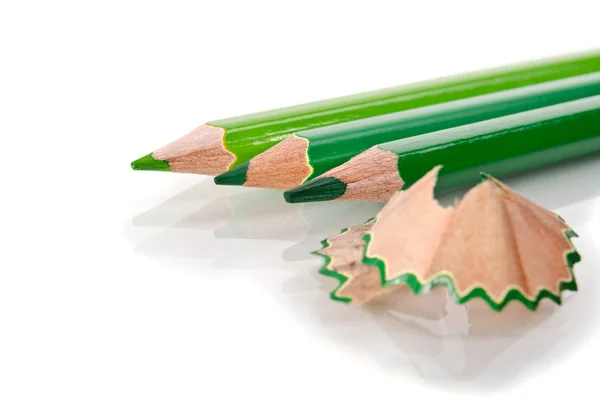 Color pencills with sharpening shavings on white background — Stock Photo, Image