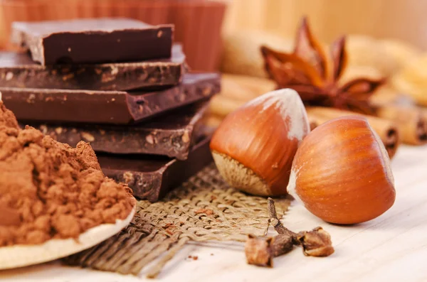 Chocolate, spices and nuts- sweet food — Stock Photo, Image