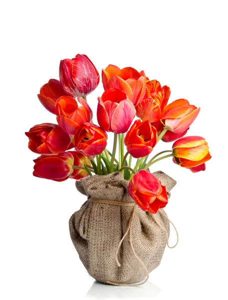 Red tulips vase wrapped in burlap on white background — Stock Photo, Image