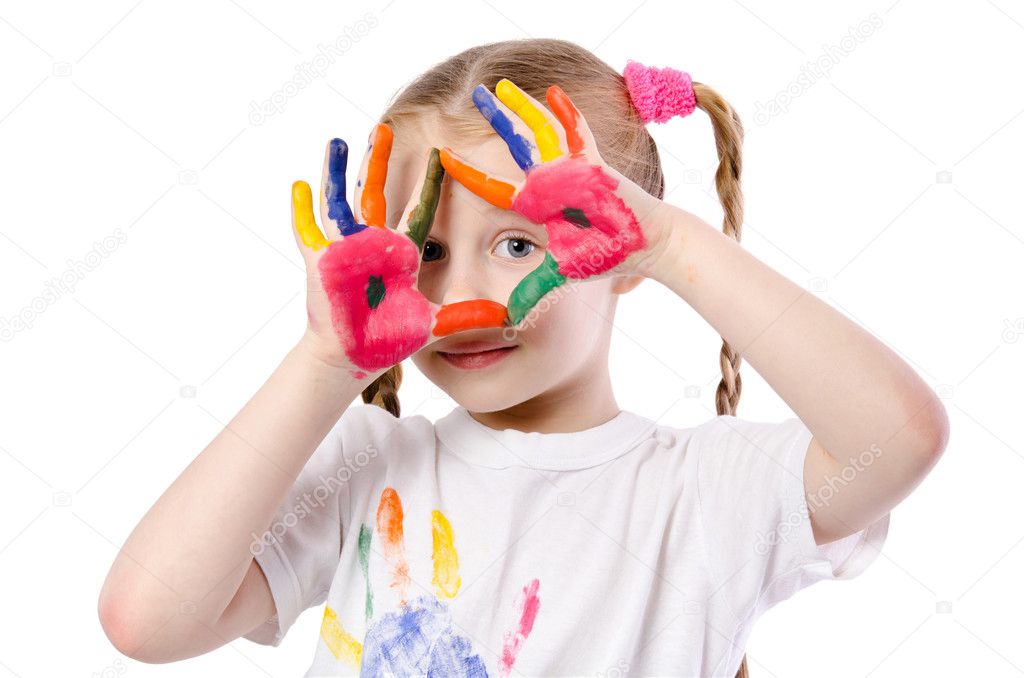Portrait of a cute cheerful girl showing her hands painted in br