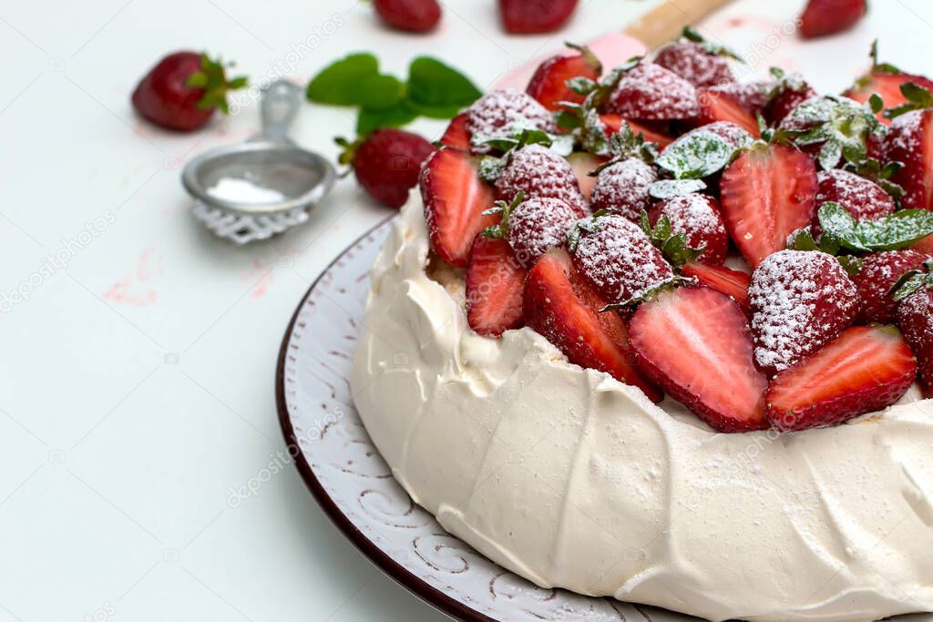 Homemade cake Pavlova with strawberries on top - sweet food