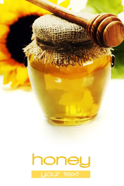 Honey and flowers — Stock Photo, Image