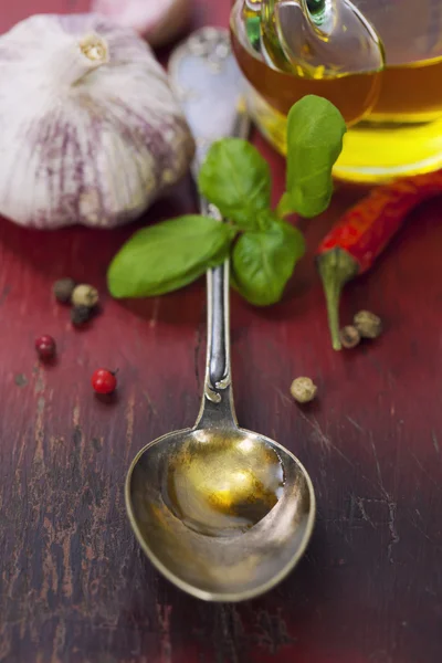 Spoon with Olive Oil and vegetables — Stock Photo, Image