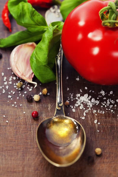 Spoon with Olive Oil and vegetables — Stock Photo, Image