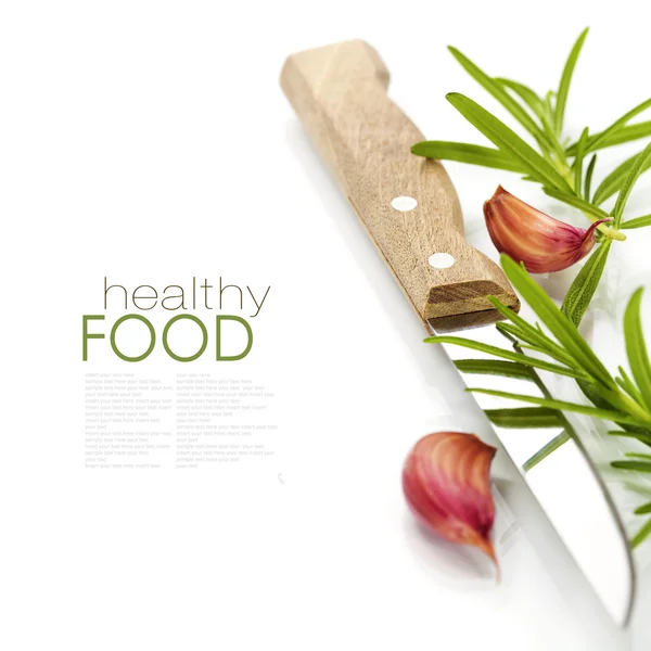 Closeup of garlic,rosemary and knife — Stock Photo, Image