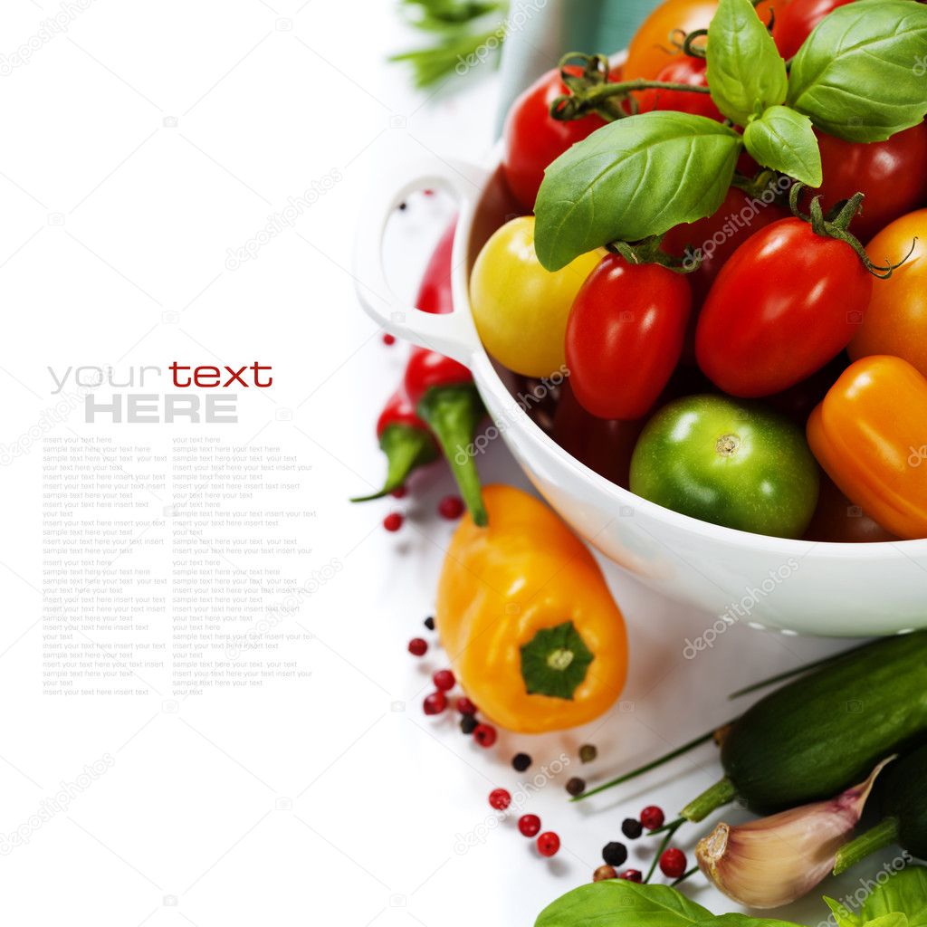 Assorted tomatoes and vegetables in colander