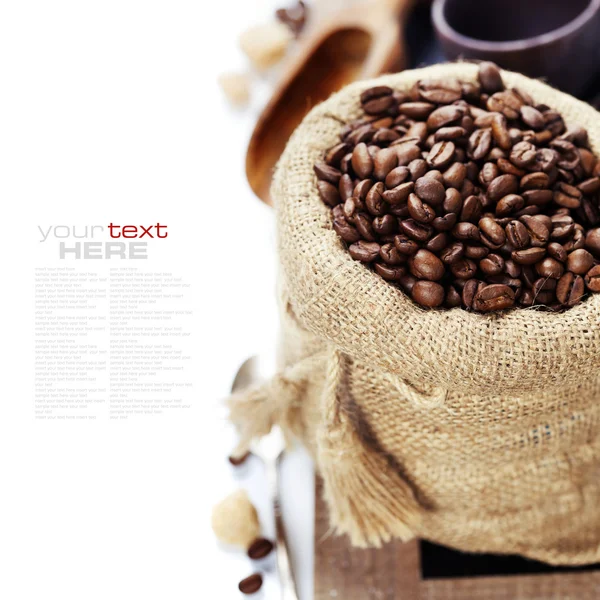 Coffee beans in burlap sack — Stock Photo, Image