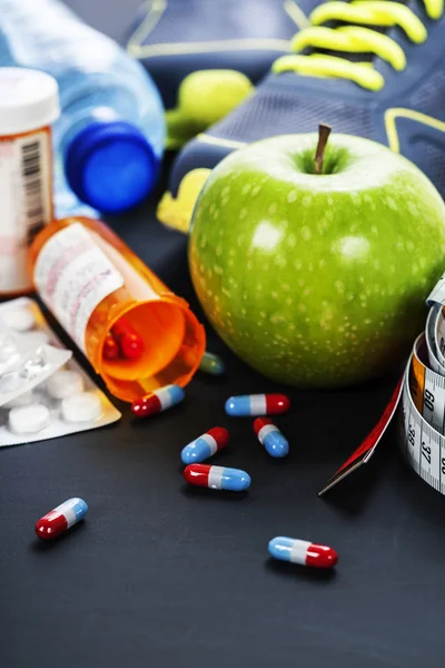 Different tools for sport and pills — Stock Photo, Image