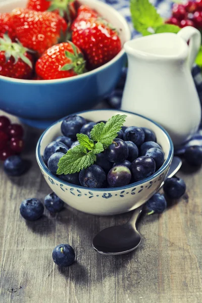 Berries in bowls  on Wooden Background. — Stock Photo, Image