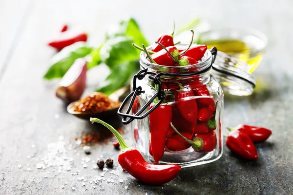 Chili peppers with herbs and spices — Stock Photo, Image