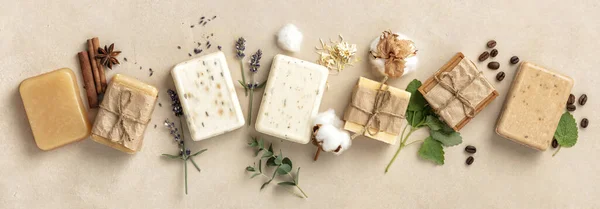 Natural soap bars and ingredients on beige background, flat lay — Stock Photo, Image