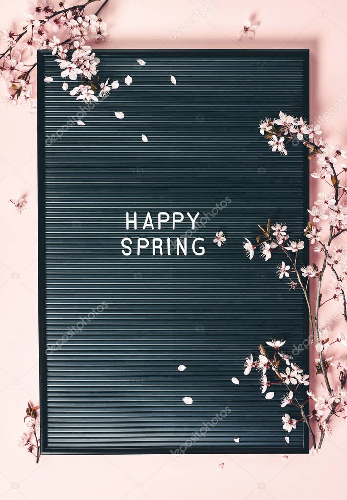 Easter background with letter board and spring flowers