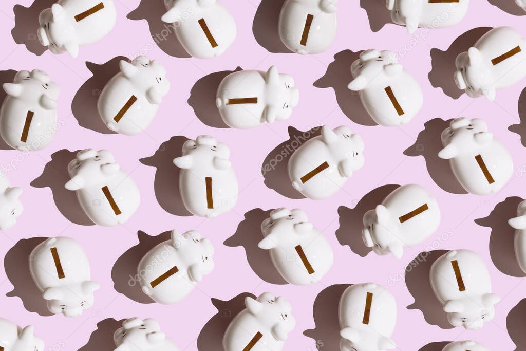 White piggy banks on pink background. Minimal financial and money saving pattern concept.