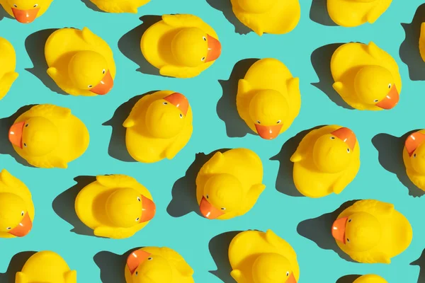 Trendy pop art design of a yellow rubber duck pattern from a top view. Dissenting opinion, chosen one, not like everyone else.