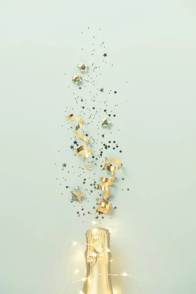 Flat Lay Celebration Champagne Bottle Gold Party Streamers Blue Background — Stock Fotó