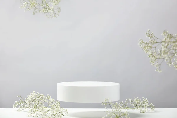 Flying Empty White Podium White Gypsophila Flowers Grey Background Mock — Fotografia de Stock