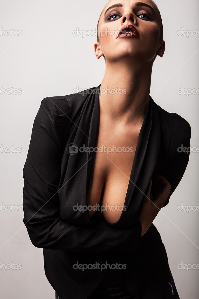 Beautiful woman pose in studio. Vogue style photo.