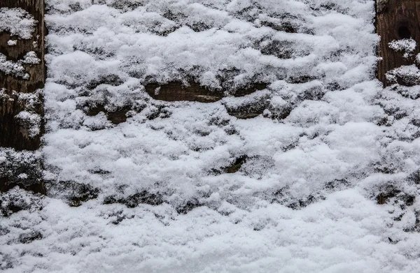 Clôture en bois dans la neige — Photo