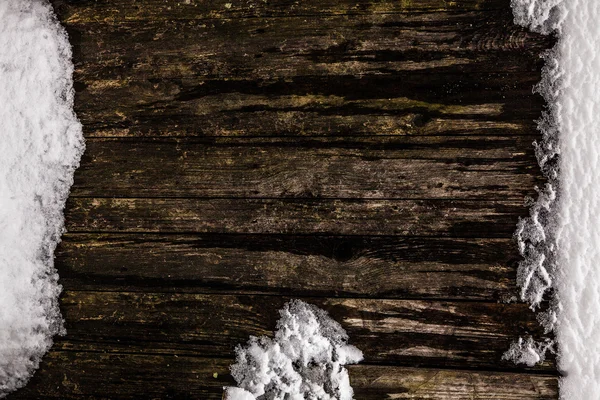 Clôture en bois dans la neige — Photo