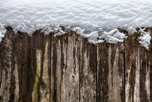 Houten hek in de sneeuw — Stockfoto