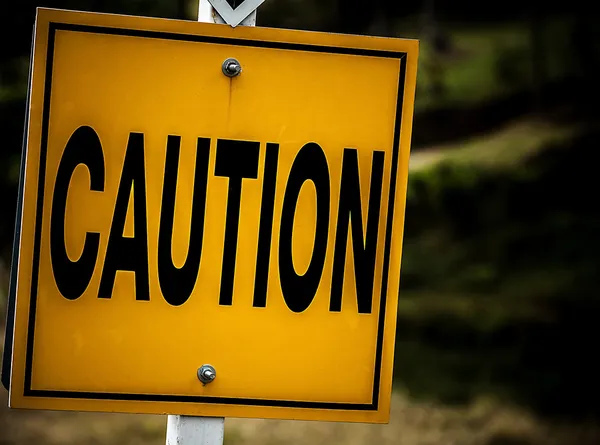 Road sign with a caution concept. — Stock Photo, Image