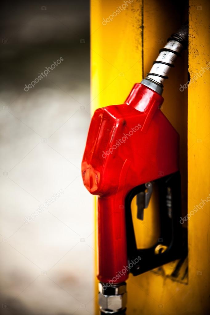 Gas pump nozzles in a service station