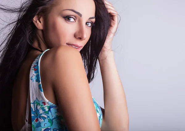 Attractive friendly brunette pose in studio. — Stock Photo, Image