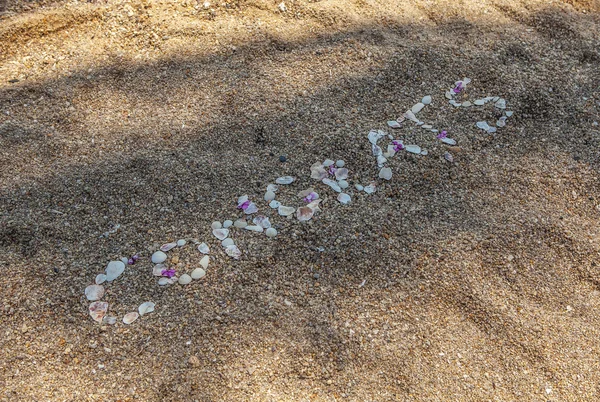 Congrats pebble word on beach sand — Stock Photo, Image